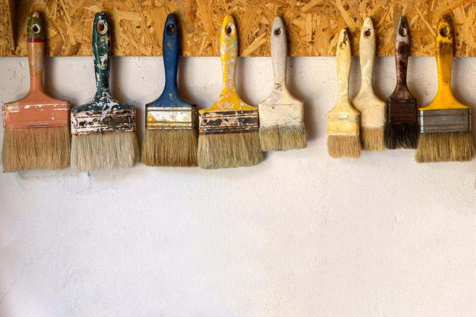 Hanging paint brushes to dry.