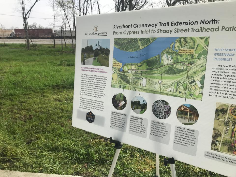 A train passes behind Shady Street Trailhead Park, which is part of the city's planned riverfront trail system.