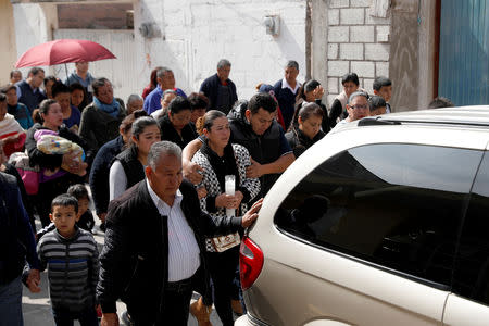 Relatives and friends take part in a funeral procession for Cesar Jimenez Brito, 40, who died during the explosion of a fuel pipeline ruptured by suspected oil thieves, in the municipality of Tlahuelilpan, state of Hidalgo, Mexico January 20, 2019. REUTERS/Henry Romero