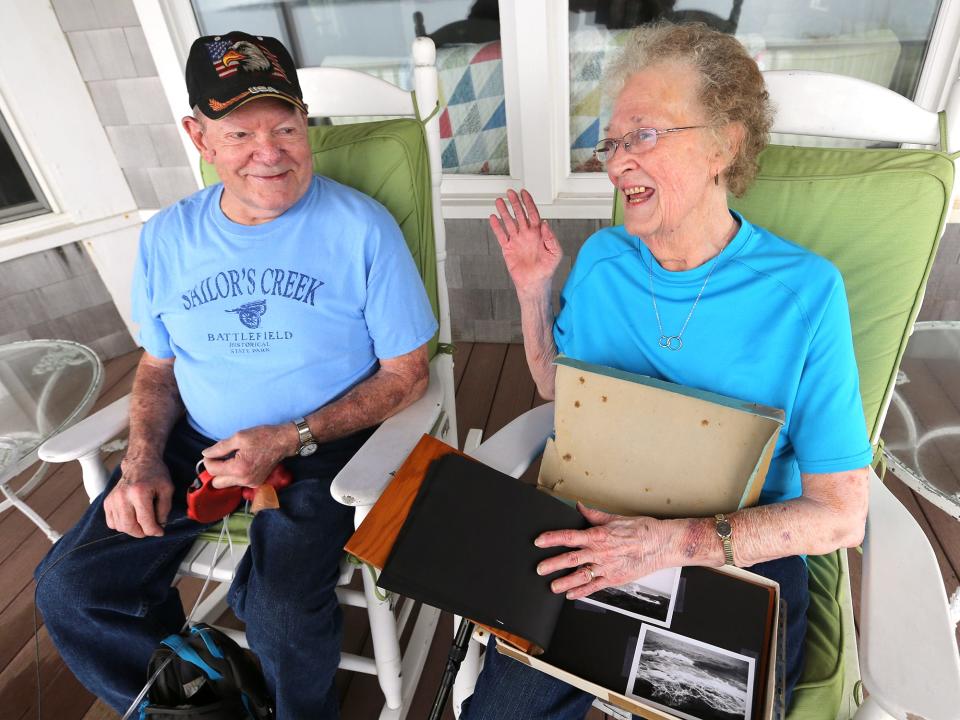 Patricia and Richard Hathaway flip through their honeymoon album they bought when they came to York Beach 60 years ago. 