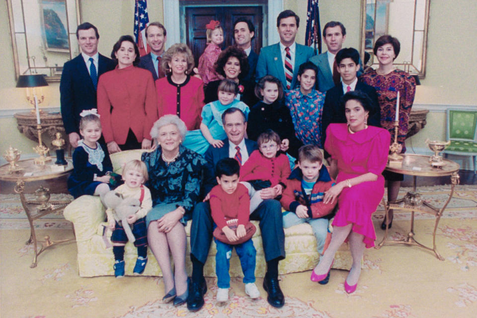 George H.W. and Barbara Bush pose with their adult children and extended family in the White House.