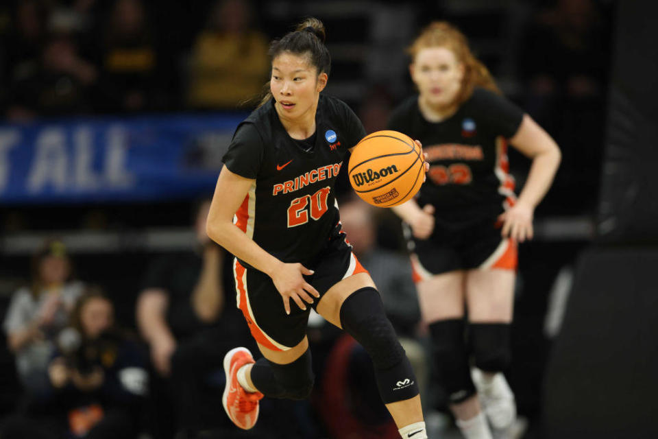 Kaitlyn Chen #20 of the Princeton Tigers dribbles the ball against the West Virginia   Mountaineers during the first round of the 2024 NCAA Women's Basketball Tournament held at Carver-Hawkeye Arena on March 23 in Iowa City, Iowa. / Credit: Rebecca Gratz/NCAA Photos via Getty Images