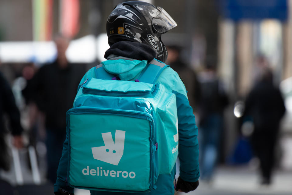 CARDIFF, UNITED KINGDOM - MARCH 13: A Deliveroo worker on March 13, 2020 in Cardiff, United Kingdom. Food delivery services have reported a surge in sales as consumers opt to stay in during the coronavirus pandemic in the UK. (Photo by Matthew Horwood/Getty Images)