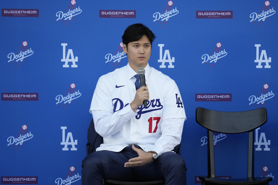 Los Angeles Dodgers' Shohei Ohtani answers questions during a baseball news conference at Dodger Stadium Thursday, Dec. 14, 2023, in Los Angeles. (AP Photo/Ashley Landis)