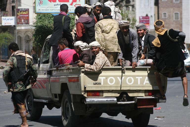 Yemeni fighters from the Popular Resistance Committees patrol the city of Taez, on May 3, 2015