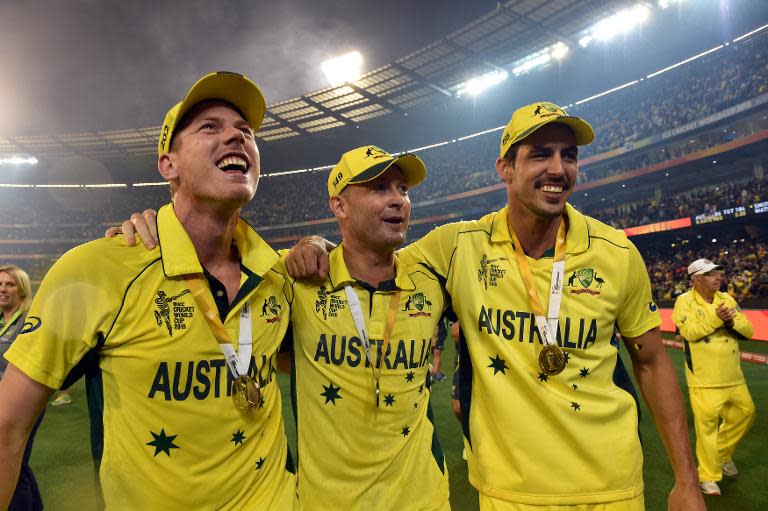 Australia's James Faulkner (L), Michael Clarke (C) and Mitchell Johnson celebrate after winning the Cricket World Cup final against New Zealand in Melbourne on March 29, 2015