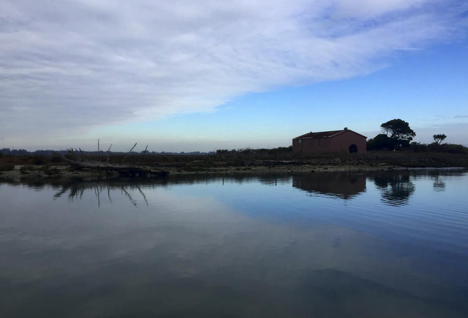 This undated photo provided by the Wiyot Tribe shows the historic village of Tuluwat on Indian Island north of Eureka, Calif. On Monday, Oct. 21, 2019, the city of Eureka will sign over the deed to the largest chunk, more than 200 acres in what was the historic village of Etpidolh. No money was exchanged. (Wiyot Tribe via AP)