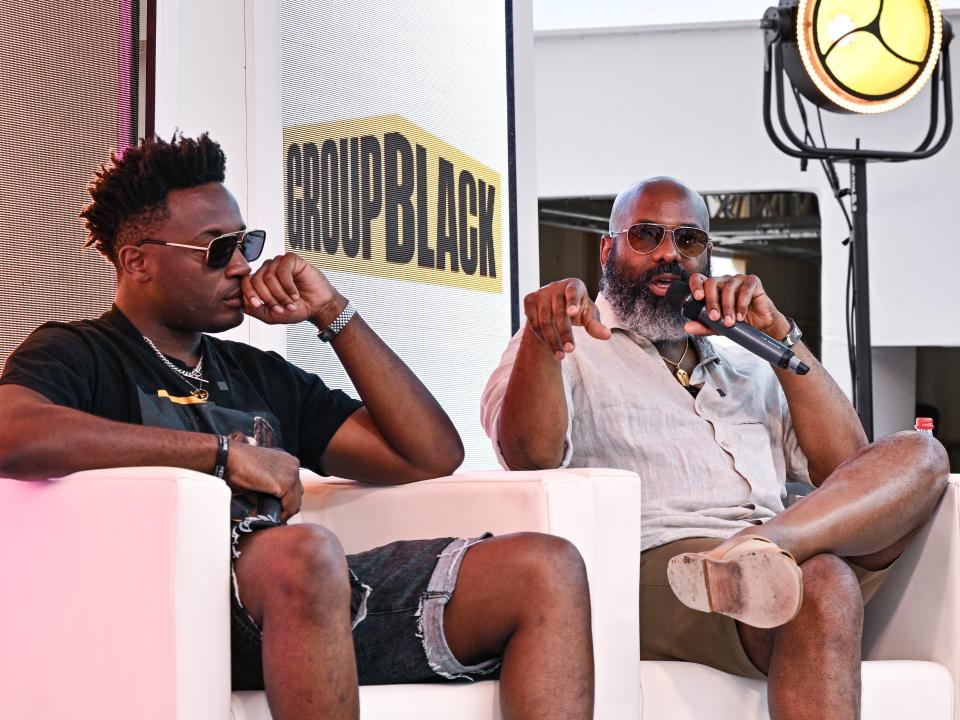 Travis Montaque and Richelieu Dennis speak during the Embracing the Influence: Black Culture, Media and Democracy panel at Inkwell Beach on June 22, 2023 in Cannes, France.