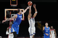 United States's Jayson Tatum (10) shoots against Czech Republic's Ondrej Balvin (12) during a men's basketball preliminary round game at the 2020 Summer Olympics, Saturday, July 31, 2021, in Saitama, Japan. (AP Photo/Eric Gay)