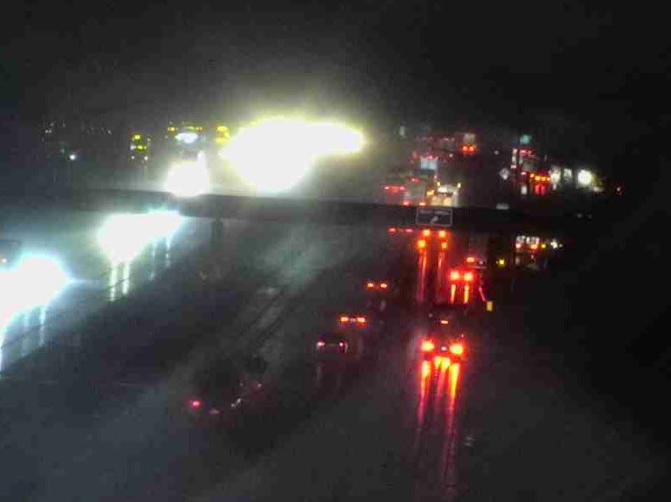 An ODOT traffic camera at Interstate 71 and Plumb Road in Delaware County shows tractor-trailers and numerous other vehicles pulling over at a rest stop as a heavy tornado-warned storm with torrential rain and strong lightning moved through the county.