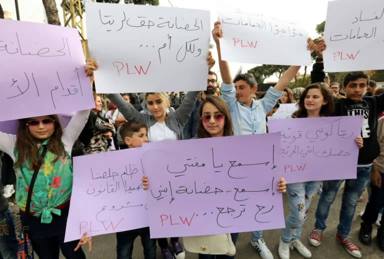 Lebanese protesters rally in front of the Supreme Shiite Council in Beirut to demand clerics increase the age at which the custody of children in divorce cases can be awarded to the mother