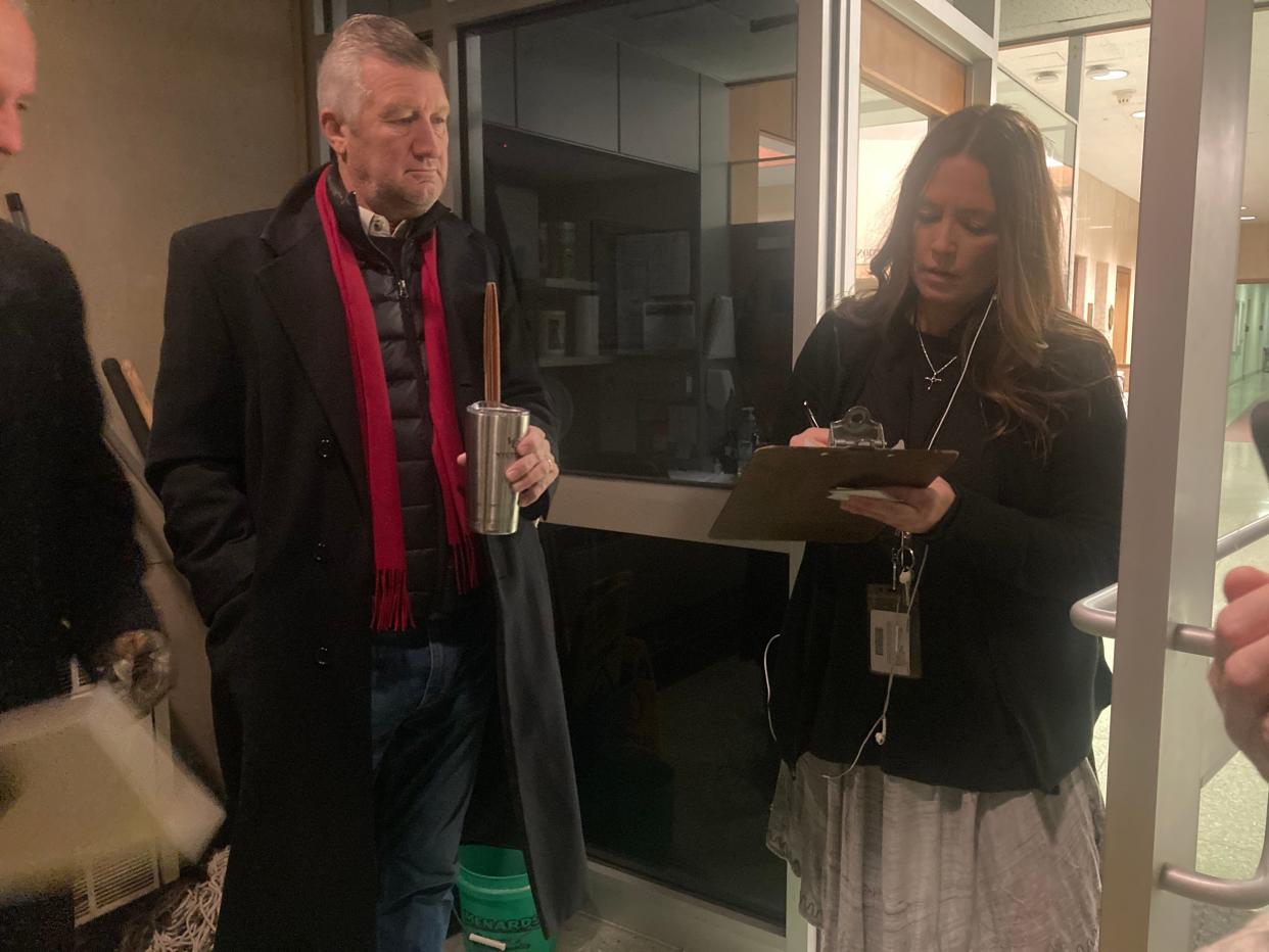 Deputy registrar Nicole Cunningham, right, checks in Ward 7 aldermanic candidate Brad Carlson Monday at Municipal Center West. Carlson was the first candidate in line for Monday's filing for the 2023 consolidated election. Carlson arrived about 5:30 a.m.