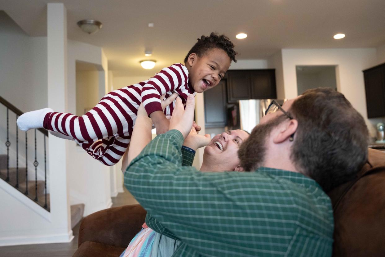 Brittney, Chris, and Samuel, 21 months, Tyler laugh together on Friday, March 1, 2024.