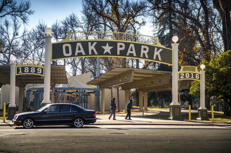 The Oak Park sign, fashioned after the original gateway arch that marked the neighborhood when it was established in 1903, welcomes visitors to McClatchy Park at 35th Street and 5th Avenue.