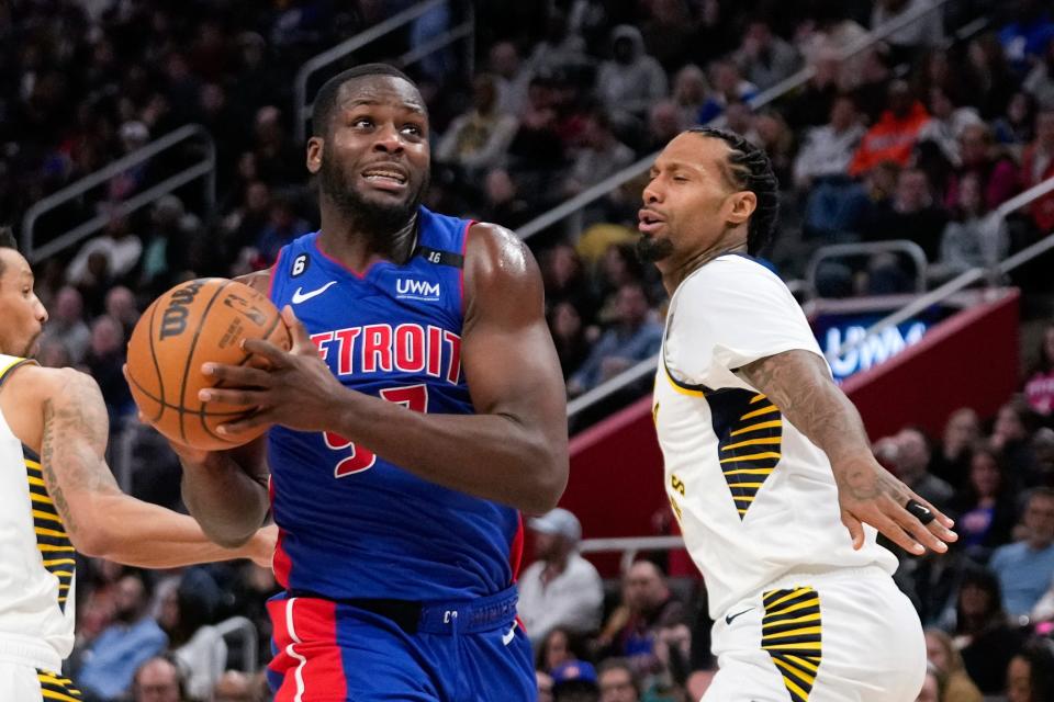 Detroit Pistons forward Eugene Omoruyi drives on Indiana Pacers forward James Johnson in the second half at Little Caesars Arena in Detroit on Saturday, March 11, 2023.