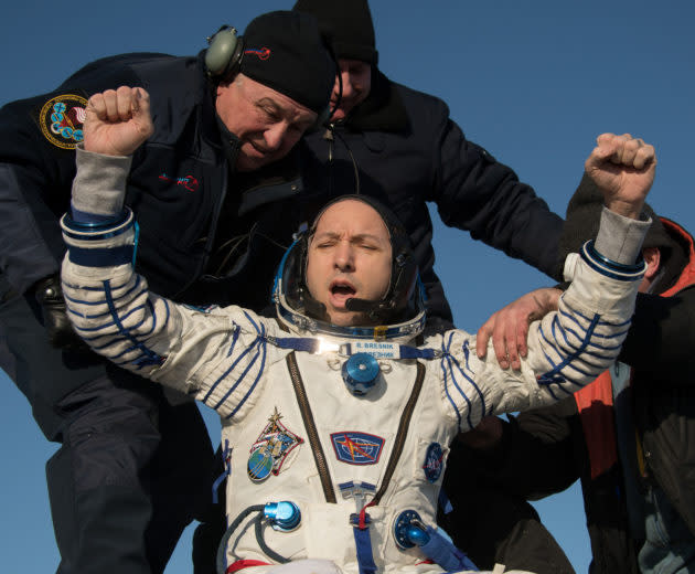 NASA astronaut Randy Bresnik is helped out of a Russian Soyuz MS-05 spacecraft just minutes after he and two other spacefliers landed in a remote area of Kazakhstan. (NASA Photo / Bill Ingalls)