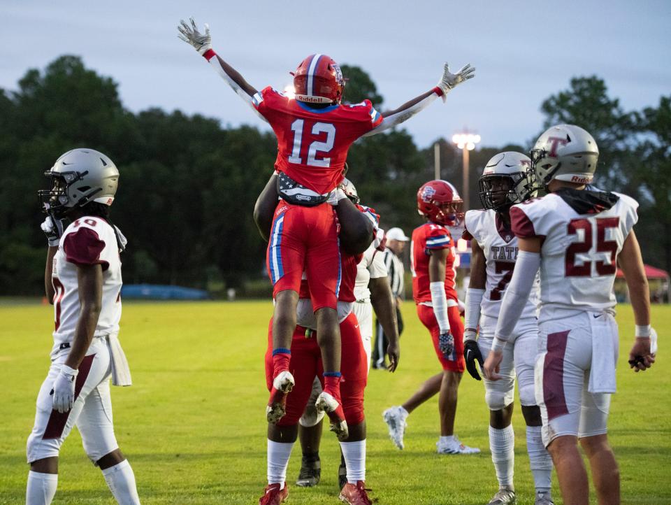 Tyquan Hunter (12) celebrates his touchdown giving the Eagles a 13-0 lead during the Tate vs Pine Forest football game at Pine Forest High School in Pensacola on Thursday, Aug. 25, 2022.