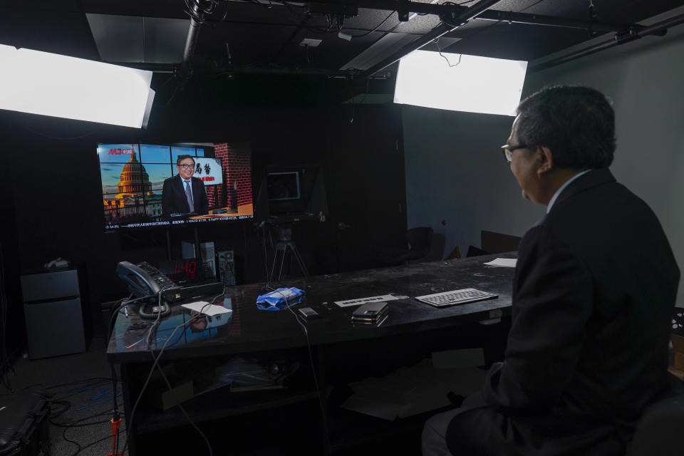 Chinese dissident Ho Pin poses for a portrait in the television studio of the Mirror Media Group during an interview with The Associated Press, Thursday, Oct. 6, 2022, in Great Neck, N.Y. Ho said that considering Xi Jinping's consolidation of power, there is little point in predicting the next leadership line up, just days before the annual Communist Party congress. (AP Photo/Mary Altaffer)