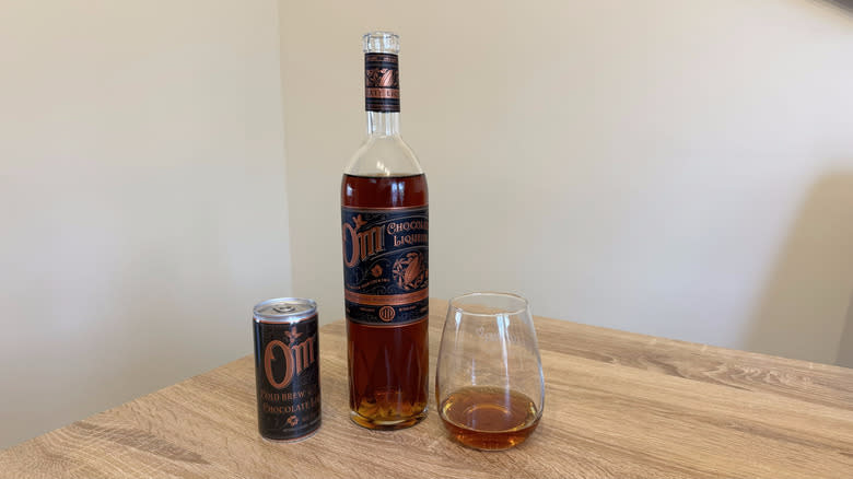 Bottle and can of Om chocolate liqueur