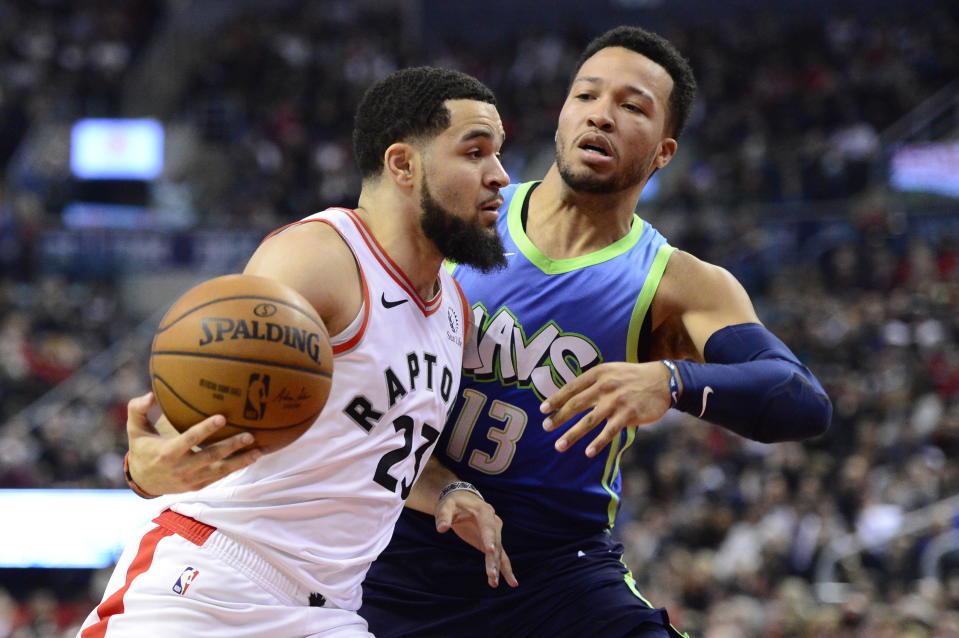 Toronto Raptors guard Fred VanVleet (23) is fouled by Dallas Mavericks guard Jalen Brunson (13) during first-half NBA basketball game action in Toronto, Sunday, Dec. 22, 2019. (Frank Gunn/The Canadian Press via AP)