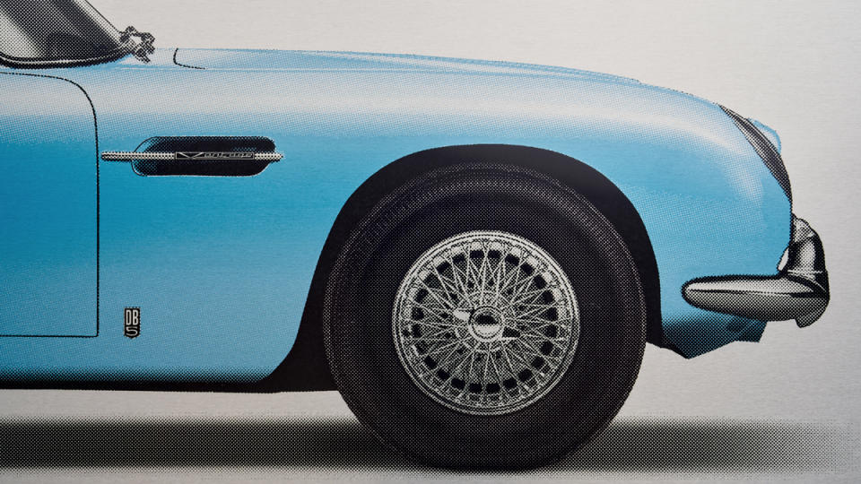 A close-up of a fine-art print of an Aston Martin DB5, part of Amalgam's Aston Martin Collection by artist Alan Thornton.