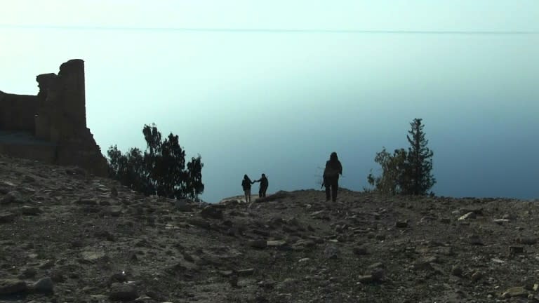 Fighters on the shores of Lake Assad, behind the Tabqa dam west of Raqa, northern Syria, seen in a screengrab taken on March 5, 2017 from an AFPTV video filmed on February 26, 2017