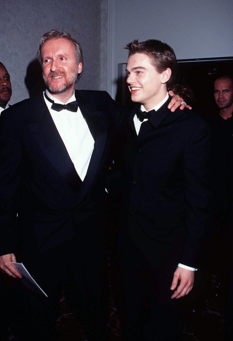 1/18/98 Beverly Hills, CA. James Cameron and Leonardo DiCaprio at the Golden Globe Awards held at the Beverly Hilton.