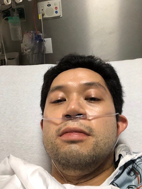 David Lat with a nasal cannula providing oxygen.
