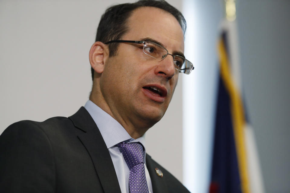 CORRECTS TO A GROUP OF 35 STATES AS WELL AS THE DISTRICT OF COLUMBIA AND TERRITORIES OF GUAM AND PUERTO RICO FILED, INSTEAD OF 38 STATES FILE - In this Oct. 7, 2019, file photo, Colorado Attorney General Phil Weiser speaks during a news conference in Denver. A group of 35 states as well as the District of Columbia and the territories of Guam and Puerto Rico filed an anti-trust lawsuit against Google on Thursday, Dec. 17, 2020, alleging that the search giant has an illegal monopoly over the online search market that hurts consumers and advertisers. The lawsuit, announced by Weiser, was filed in federal court in Washington, D.C. by states represented by bipartisan attorneys general. (AP Photo/David Zalubowski, File)