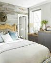 <p>Play up a bedroom's rustic flair with a wood paneled wall in varying shades of gray. </p>