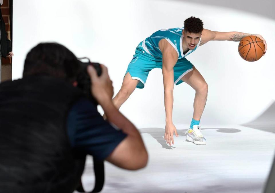 Charlotte Hornets 2020 first round draft pick LaMelo Ball dribbles as he gets photographed by NBAE photographer Kent Smith after a press conference outside the Spectrum Center on Friday.