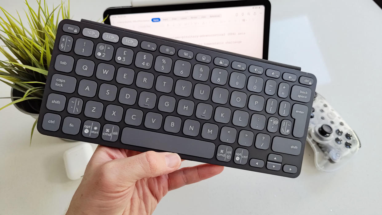  Logitech Keys-To-Go 2 in the hand. 