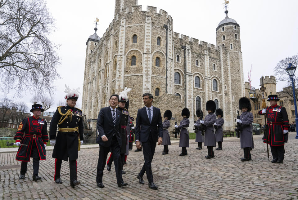 Britain's Prime Minister Rishi Sunak, center, and Japan's Prime Minister Fumio Kishida, next to him, arrive at the Tower of London, Wednesday, Jan. 11, 2023. The leaders of Britain and Japan are signing a defense agreement on Wednesday that could see troops deployed to each others’ countries. (Carl Court/Pool Photo via AP, File)