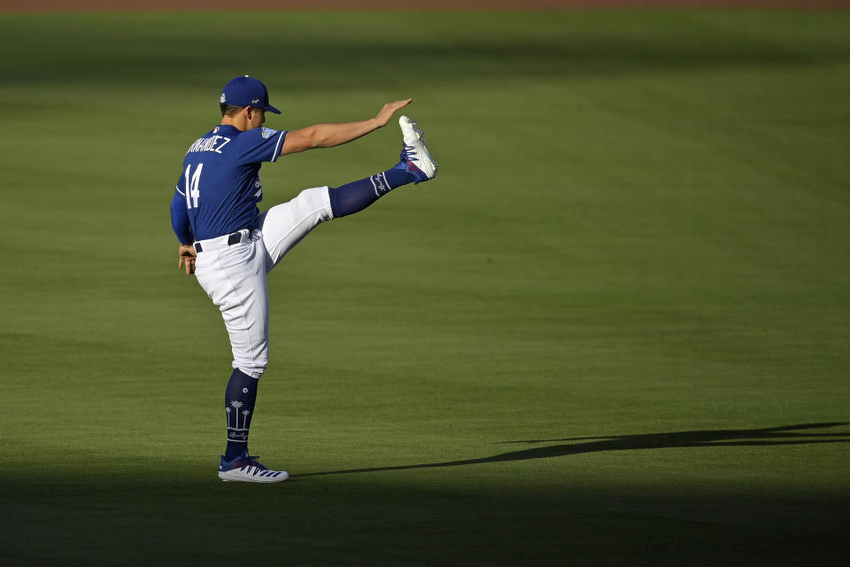 Los Angeles Dodgers left fielder Enrique Hernandez warms up during the restart of baseball spring training Monday, July 6, 2020, in Los Angeles. (AP Photo/Mark J. Terrill)