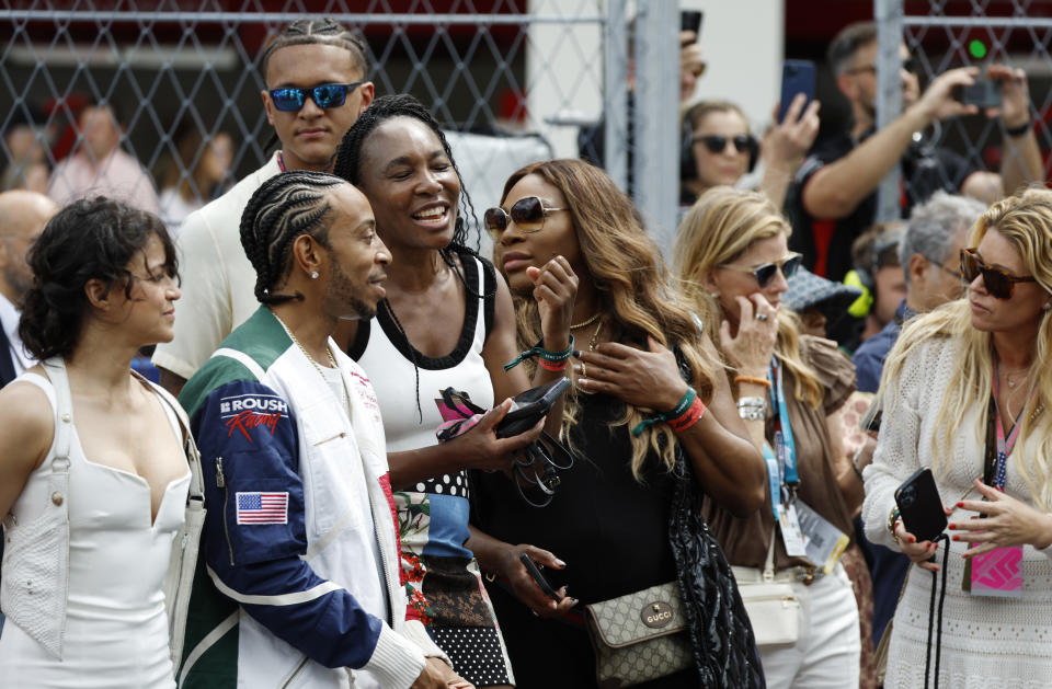 MIAMI, FLORIDA - MAY 07: Michelle Rodriguez, Ludacris, Venus Williams and Serena Williams watch the grid presentation prior to the F1 Grand Prix of Miami at Miami International Autodrome on May 07, 2023 in Miami, Florida. (Photo by Chris Graythen/Getty Images)