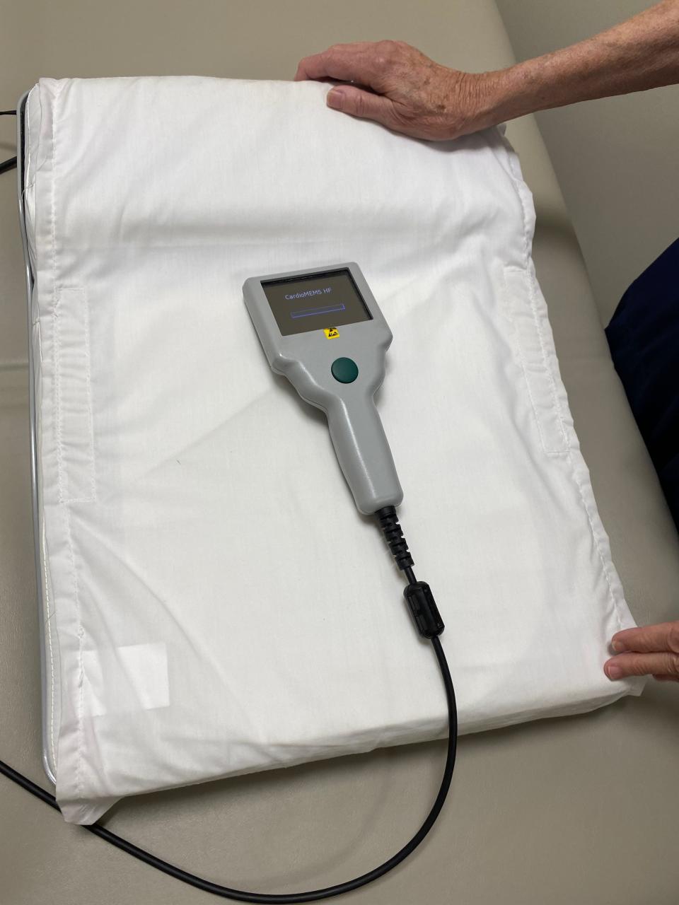 The pillow that sends data to hospitals from the CardioMEMS implant device.