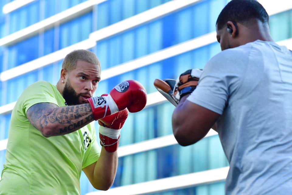 Deron William, left, works out at the Seminole Hard Rock Tampa pool prior to his fight against Frank Gore on Saturday night.