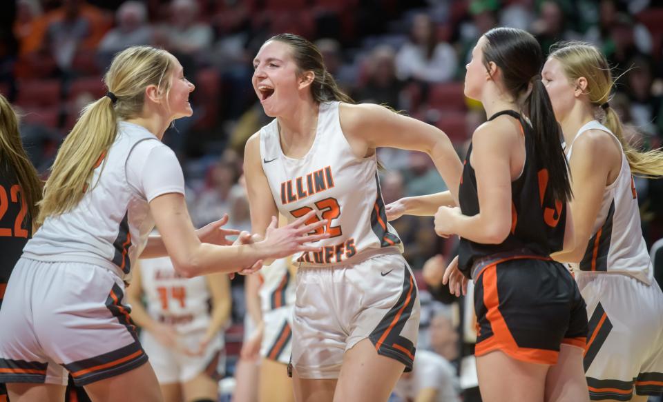Illini Bluffs' Lily Luczkowiak (32) and her teammates celebrate a score and a foul against Altamont in the second half of their Class 1A girls basketball state semifinal Thursday, Feb. 29, 2024 at CEFCU Arena in Normal. The Tigers defeated the Lady Indians 60-48 in overtime.