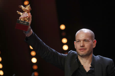 Nadav Lapid recieves Golden Bear for Best Film, during the awards ceremony at the 69th Berlinale International Film Festival in Berlin, Germany, February 16, 2019. REUTERS/Hannibal Hanschke
