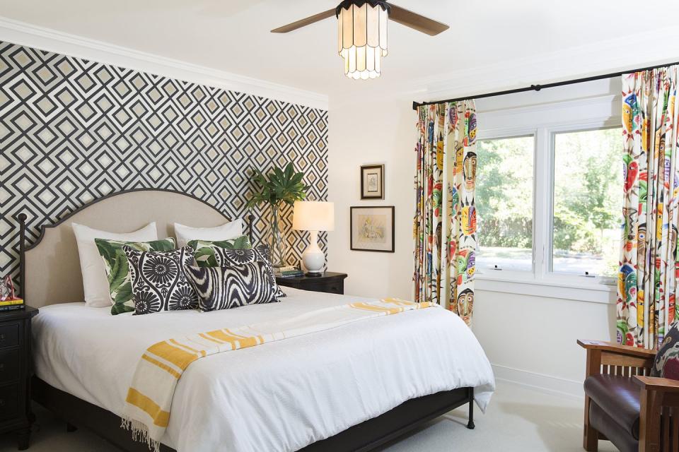 <p>Geometric wallpaper and colorful drapery feel exuberant in a bedroom by <a href="https://deringhall.com/interior-designers/pepperjack-interiors" rel="nofollow noopener" target="_blank" data-ylk="slk:PepperJack Interiors;elm:context_link;itc:0;sec:content-canvas" class="link ">PepperJack Interiors</a>.</p>