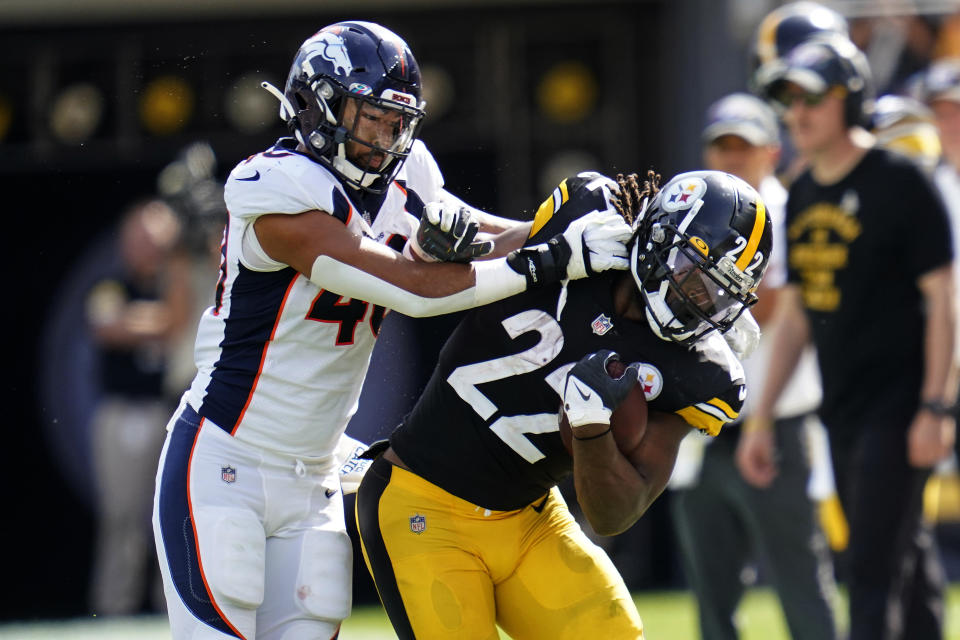 Pittsburgh Steelers running back Najee Harris (22) is shoved out of bounds by Denver Broncos inside linebacker Justin Strnad (40) during the first half of an NFL football game in Pittsburgh, Sunday, Oct. 10, 2021. (AP Photo/Keith Srakocic)