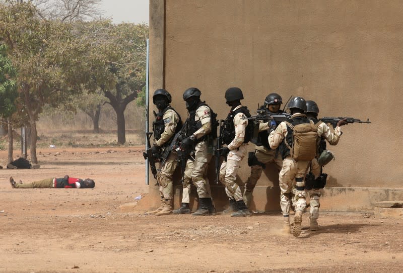 Soldiers from Burkina Faso participate in a simulated raid during the U.S. sponsored Flintlock exercises in Ouagadougou, Burkina Faso