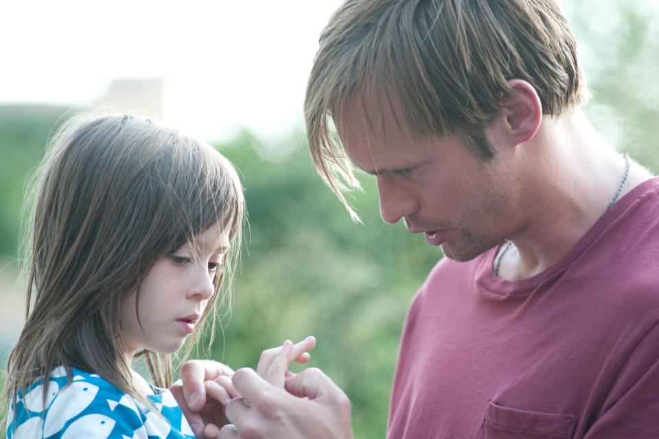 This film image released by Millennium Entertainment shows Onata Aprile, left, and Alexander Skarsgard in a scene from "What Maisie Knew." (AP Photo/Millennium Entertainment, JoJo Whilden)