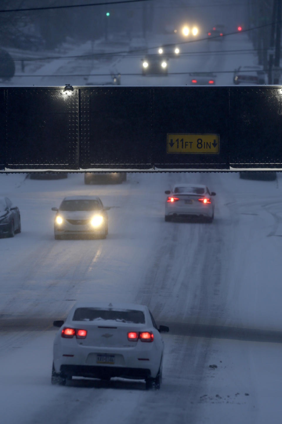 Motorists make their way along an icy road Sunday Jan. 31, 2021 in Philadelphia. After days of frigid temperatures, the Northeast is bracing for a whopper of a storm that could dump well over a foot of snow in many areas and create blizzard-like conditions. (AP Photo/Jacqueline Larma)