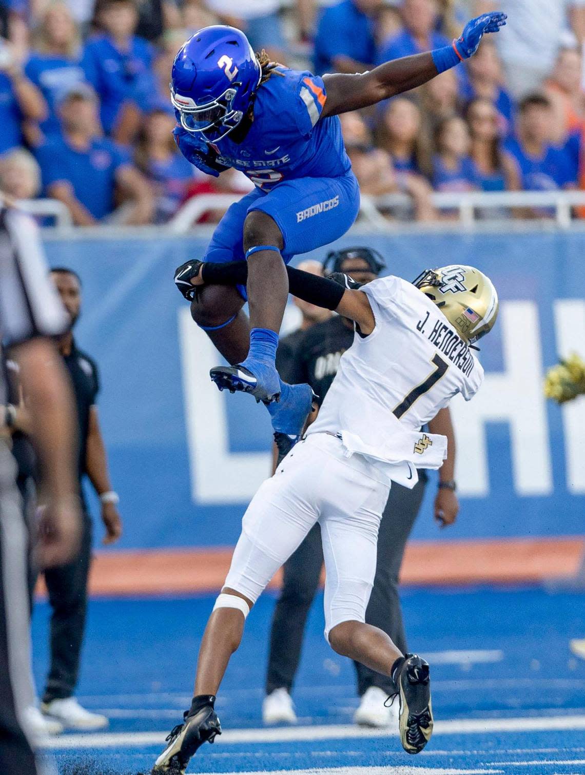 Boise State running back Ashton Jeanty leaps over UCF defensive back Fred Davis on a run in the second half Sept. 9 at Albertsons Stadium.