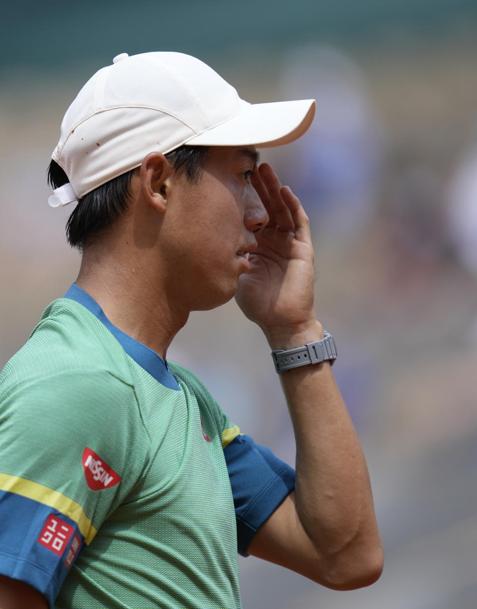 Japan's Kei Nishikori reacts as he wins a point against Russia's Karen Khachanov during their second round match on day four of the French Open tennis tournament at Roland Garros in Paris, France, Wednesday, June 2, 2021. (AP Photo/Thibault Camus)
