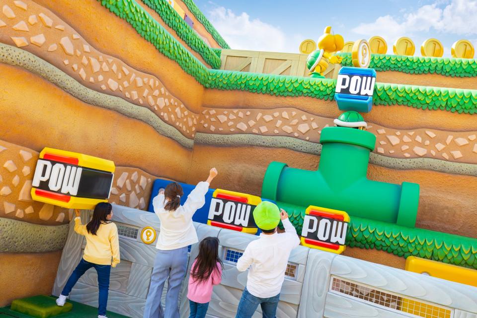 Fans play at Super Nintendo World at Universal Studios Japan, which opened on March 17, 2021.