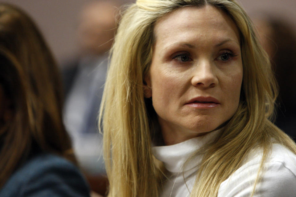 Former "Melrose Place" actress Amy Locane-Bovenizer, 40, of Hopewell Township, N.J., looks to her husband and mother as the jury in her trial returns a verdict on Tuesday, Nov. 27, 2012 in Somerville, N.J. The jurors convicted Locane-Bovenizer of vehicular homicide, but acquitted her of a more serious charge, aggravated manslaughter, in the 2010 accident that killed a 60-year-old woman. Somerset County prosecutors said Locane-Bovenizer's blood-alcohol level was nearly three times the legal limit when the crash occurred on a dark two-lane road in Montgomery Township. The defence conceded she was driving under the influence. But her lawyer claimed a woman was chasing her after an earlier accident, forcing her to speed. (AP Photo/The Star-Ledger, Robert Sciarrino, Pool)