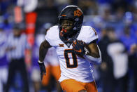 Oklahoma State running back LD Brown carries the ball against Boise State during the first half of an NCAA college football game Saturday, Sept. 18, 2021, in Boise, Idaho. (AP Photo/Steve Conner)