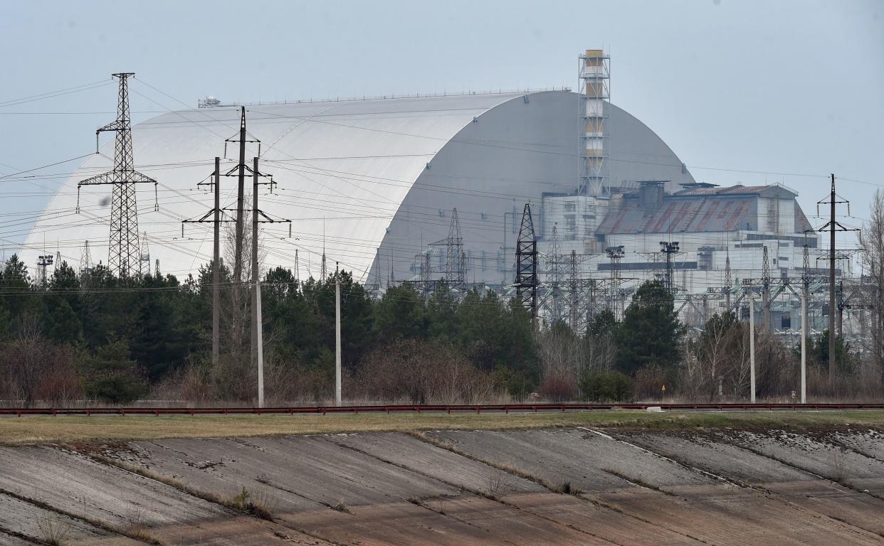 (FILES) A file picture taken on April 13, 2021 shows the giant protective dome built over the sarcophagus covering the destroyed fourth reactor of the Chernobyl Nuclear Power Plant ahead of the upcoming 35th anniversary of the Chernobyl nuclear disaster. Ukraine announced on February 24 that Russian forces had captured the Chernobyl nuclear power plant after a 